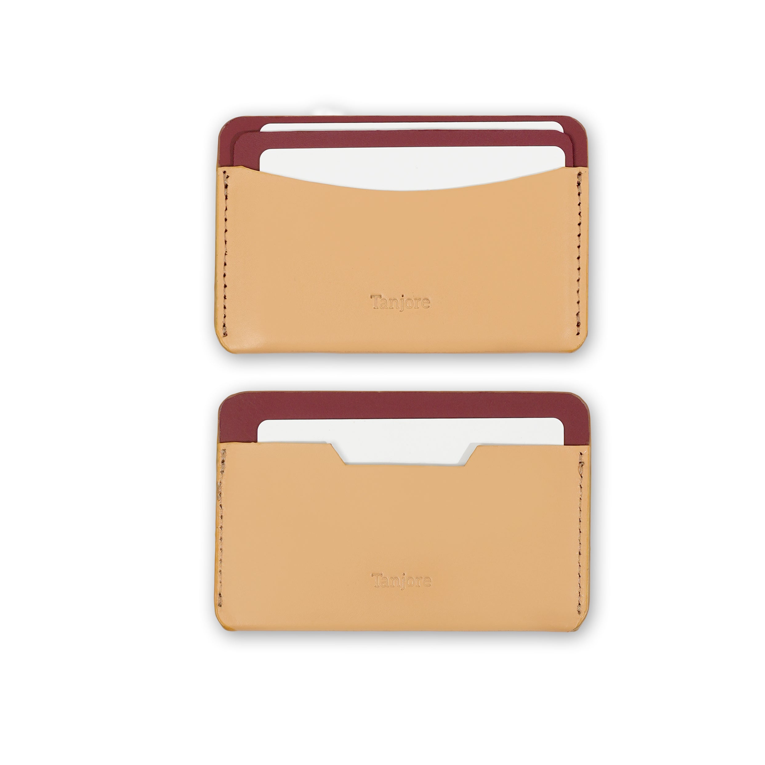 Two Tanjore wallets in Clay and Plum shown with credit cards inserted, demonstrating the functional design of the Full Grain Nappa Leather slots.