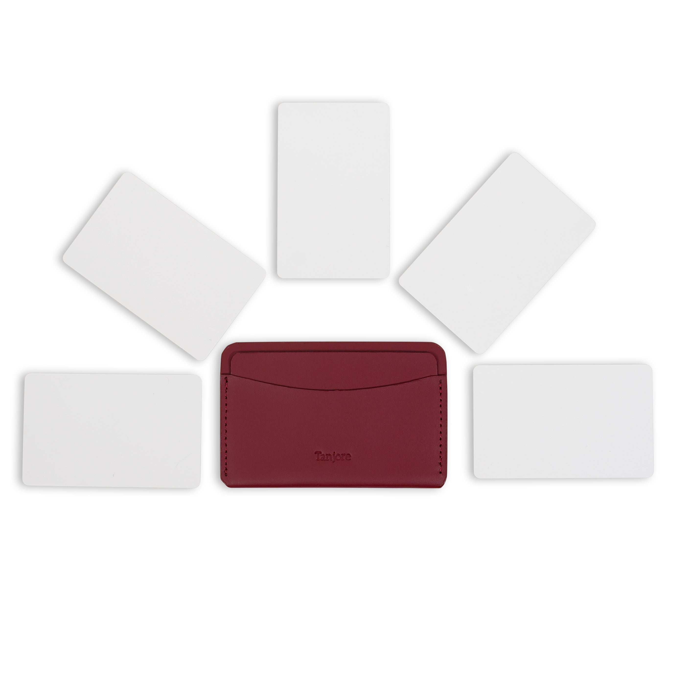 Overhead view of the Plum Tanjore cardholder surrounded by five cards to demonstrate daily carry storage capacity. Made from durable Full Grain Nappa Leather.