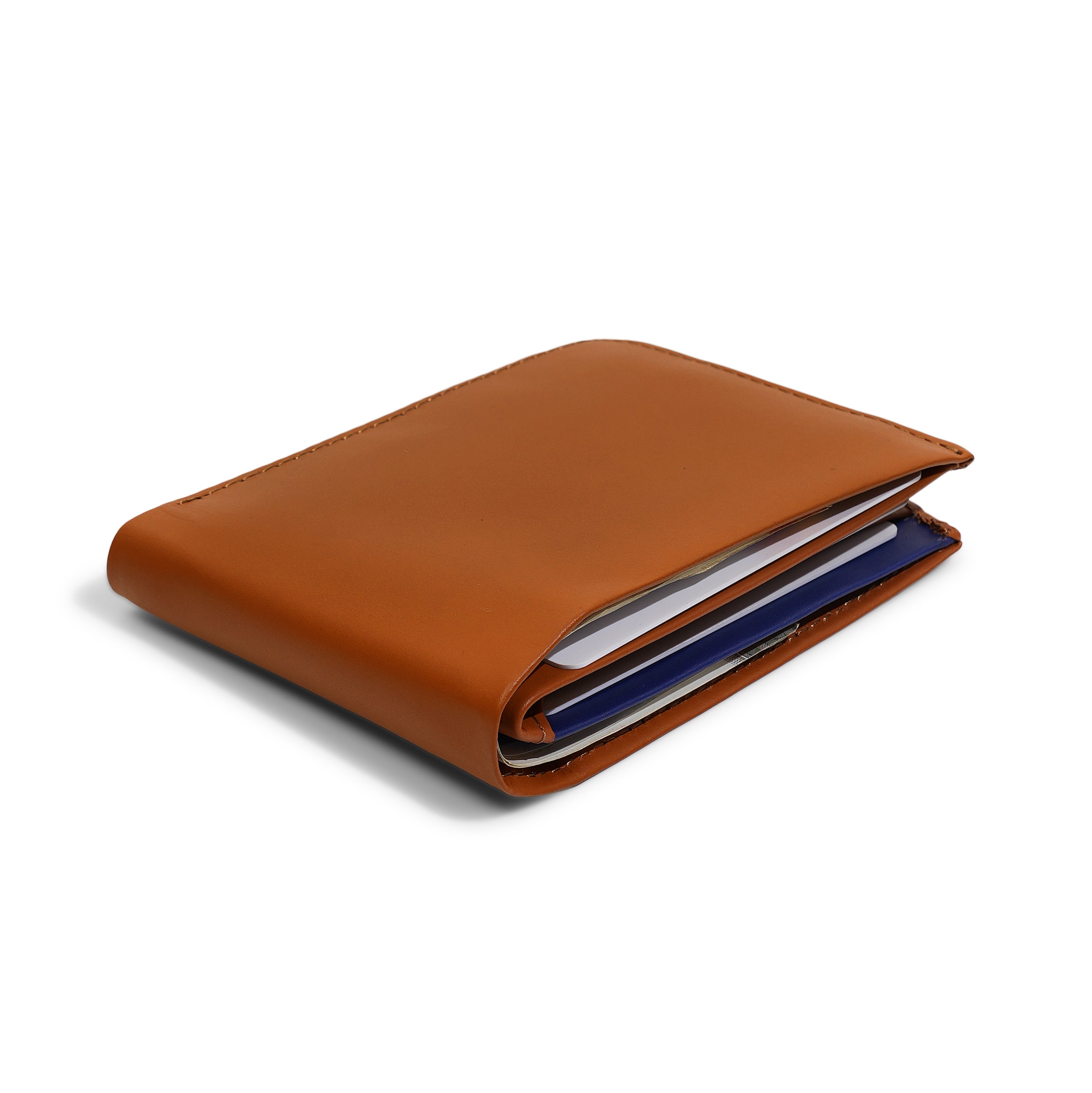 Side profile of the Tan Modern Classic 2.0 holding cash and cards. Engineered to remain a Slim Profile bifold while offering full RFID protection.