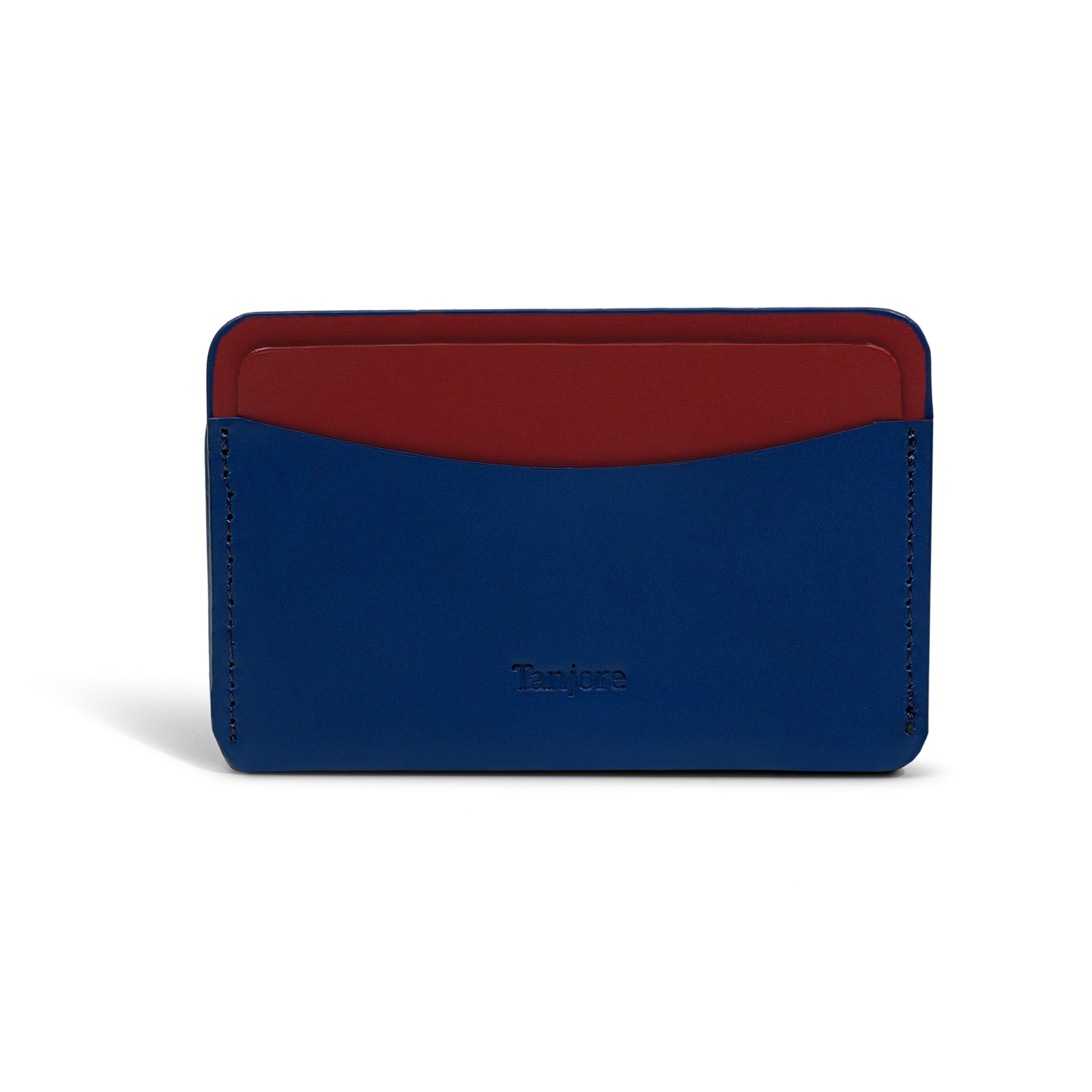 Front view of the minimalist Tanjore wallet in Navy Blue with contrasting Plum detail. Made from durable Full Grain Nappa Leather with precision stitching