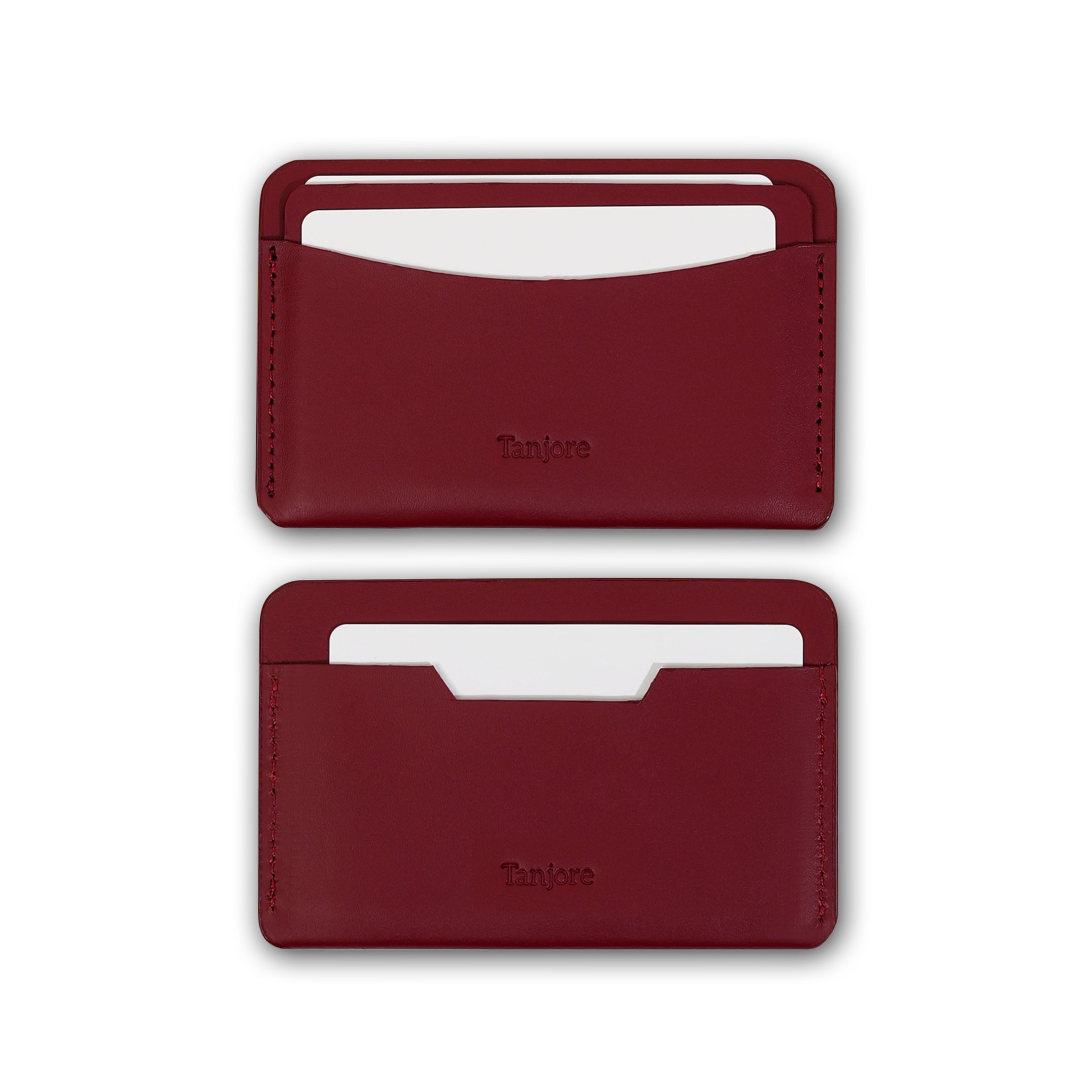Two Tanjore wallets in Plum shown with credit cards inserted, demonstrating the functional card slots made from soft Full Grain Nappa Leather.