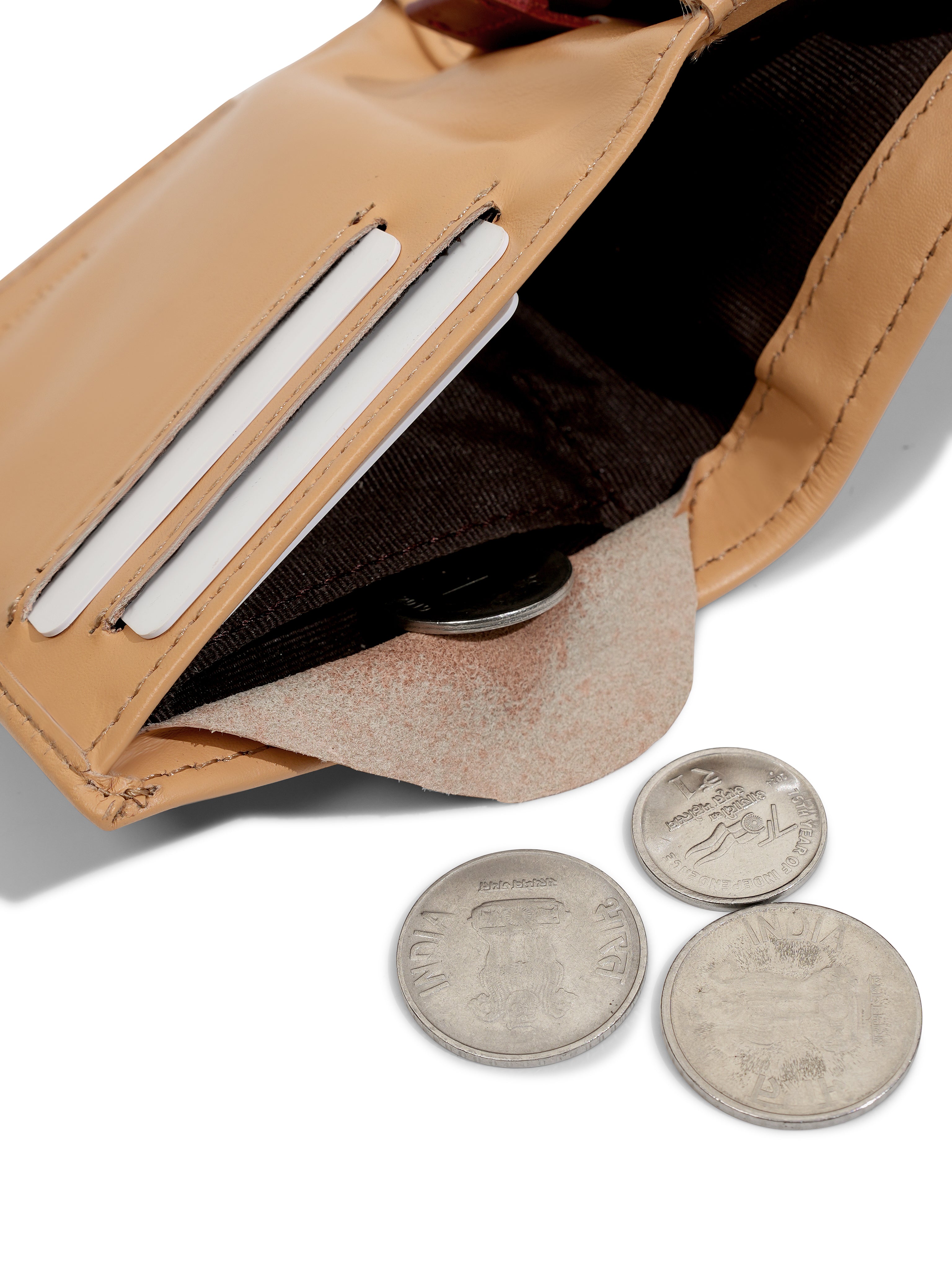 Close-up of the internal coin pocket in the Tanjore Reserve Sleeve in Clay. Functional Full Grain Nappa Leather design featuring RFID protection and a Slim Profile.