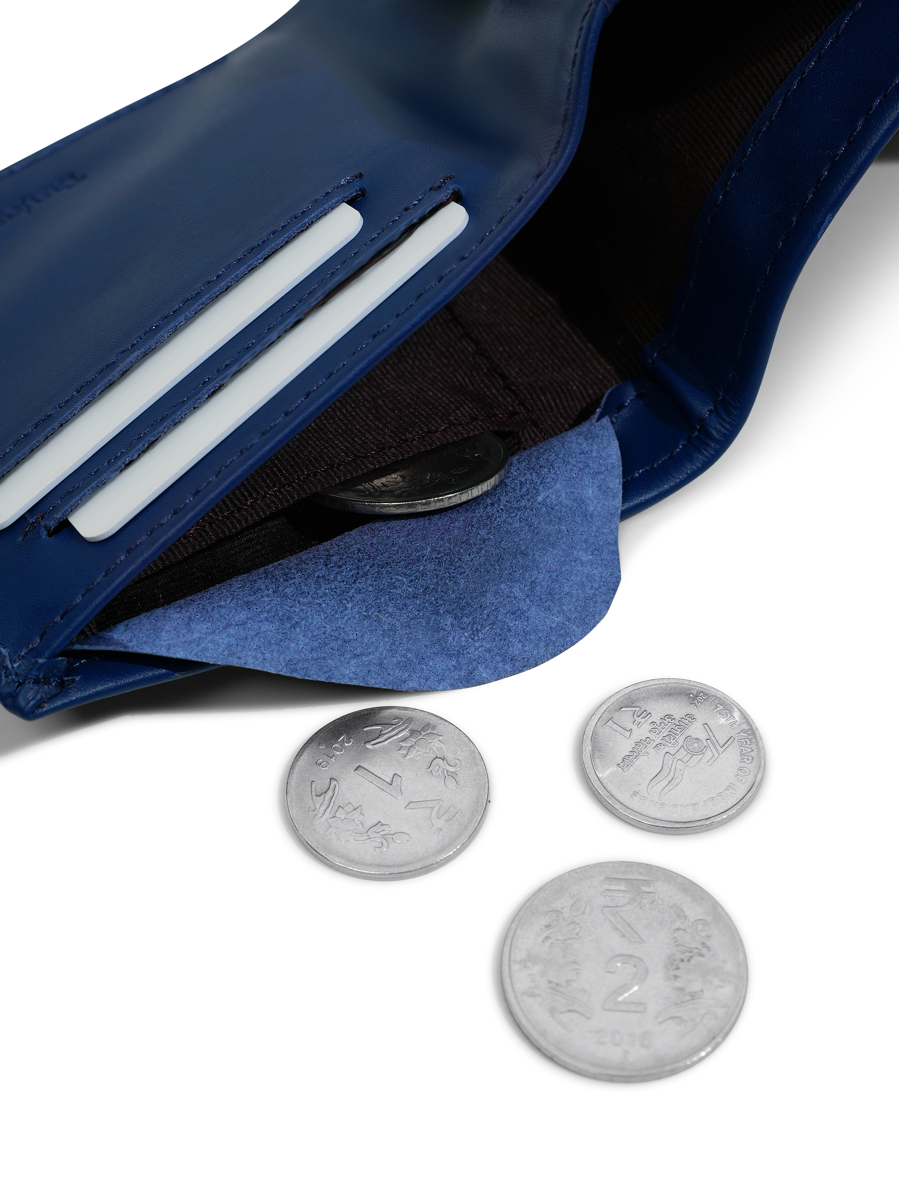Close-up of the internal coin pocket in the Tanjore Reserve Sleeve in Navy. Functional Full Grain Nappa Leather design featuring RFID protection and a Slim Profile.