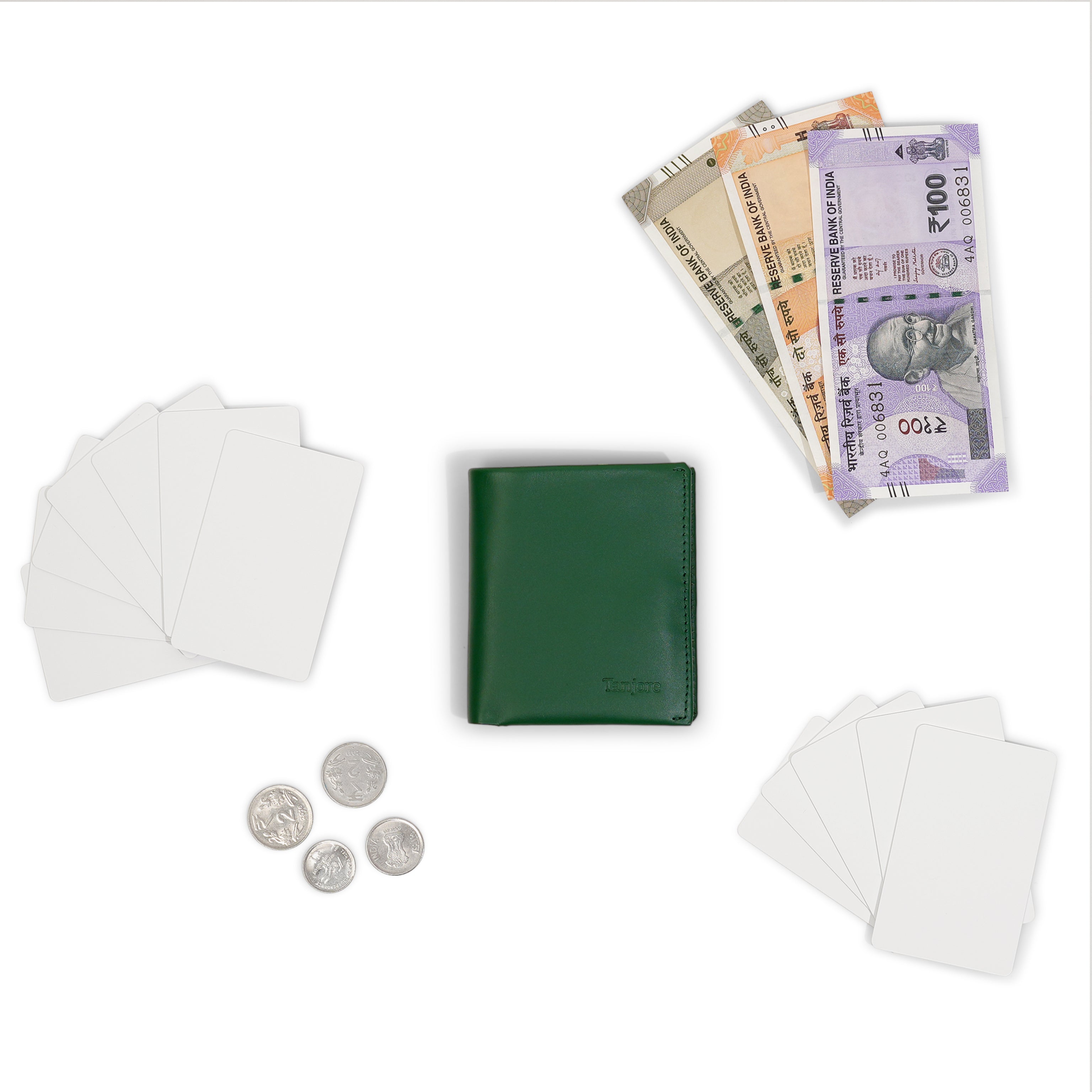Flatlay of the Tanjore Reserve Sleeve in Green displayed with Indian currency. A compact wallet with Pull Tab functionality and RFID security.