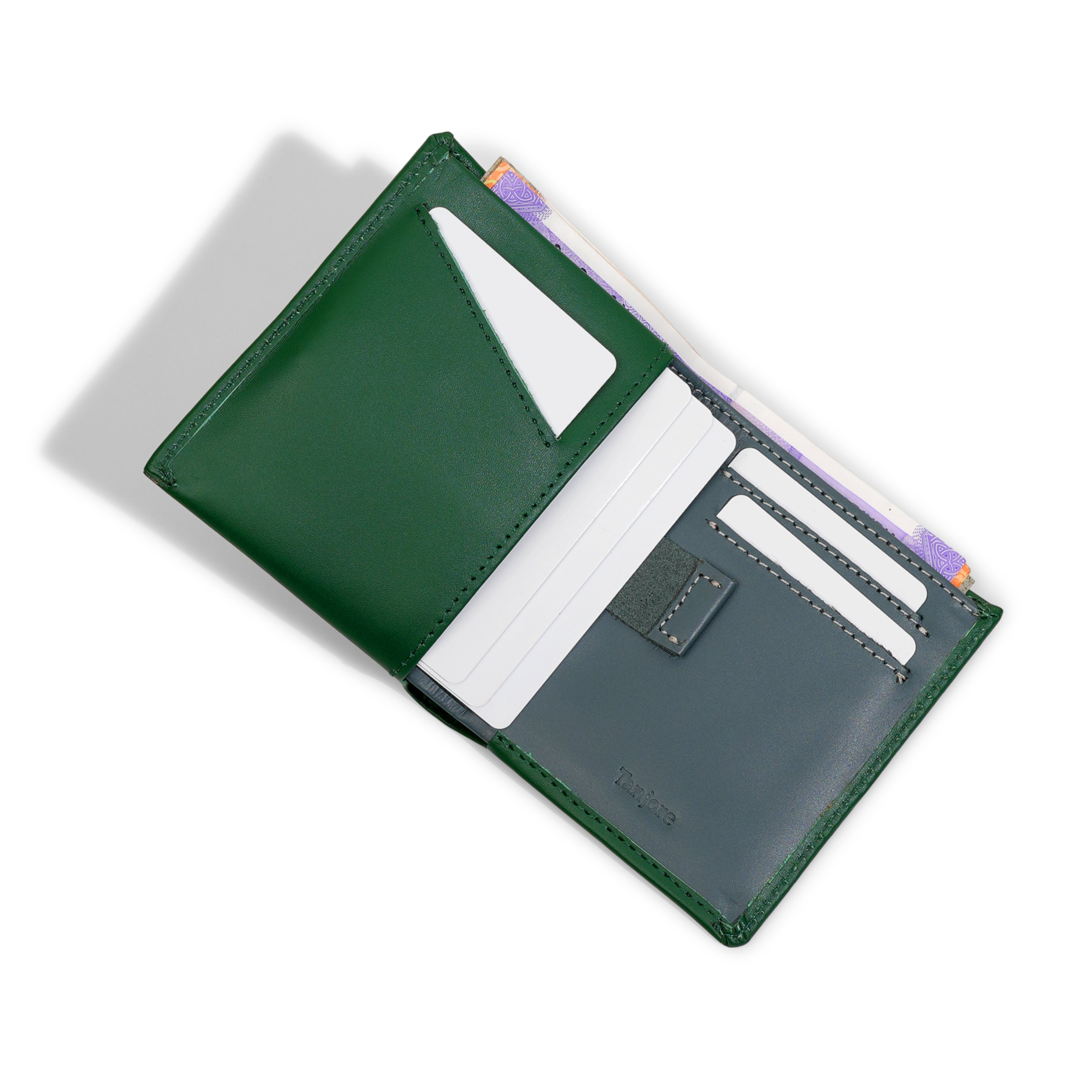 Interior open view of the Reserve Sleeve showing the Green and Grey colorway. Features a Pull Tab, card slots, and RFID protection in Full Grain Nappa Leather.