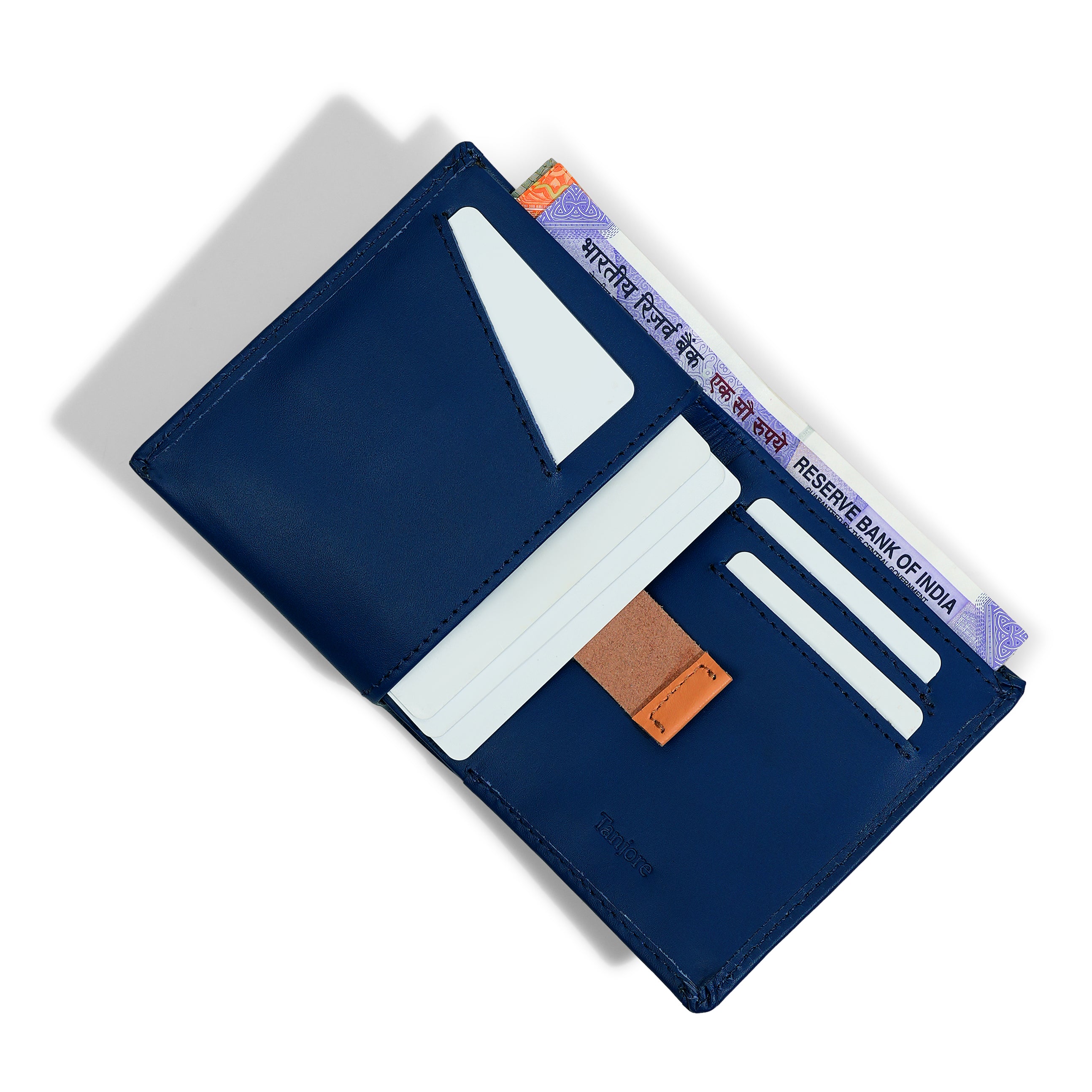 Interior open view of the Reserve Sleeve in Navy. Features a contrasting Tan Pull Tab for easy card access, RFID protection, and Full Grain Nappa Leather construction.