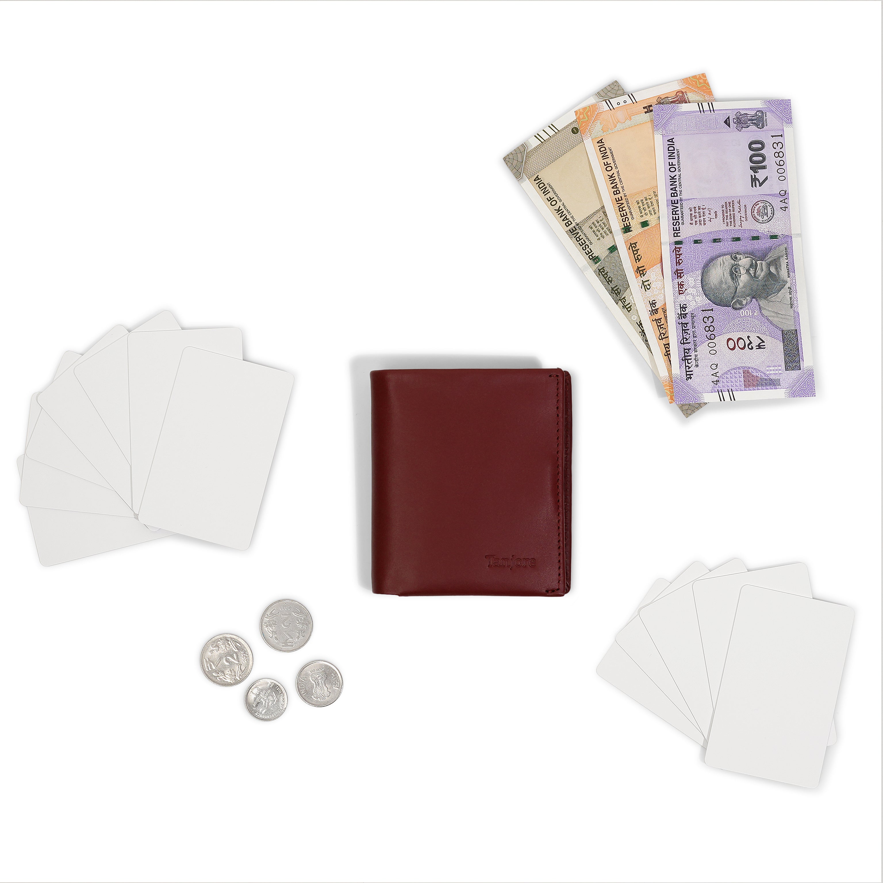 Flatlay of the Tanjore Reserve Sleeve in Plum displayed with Indian currency. A compact wallet with Pull Tab functionality and RFID security.