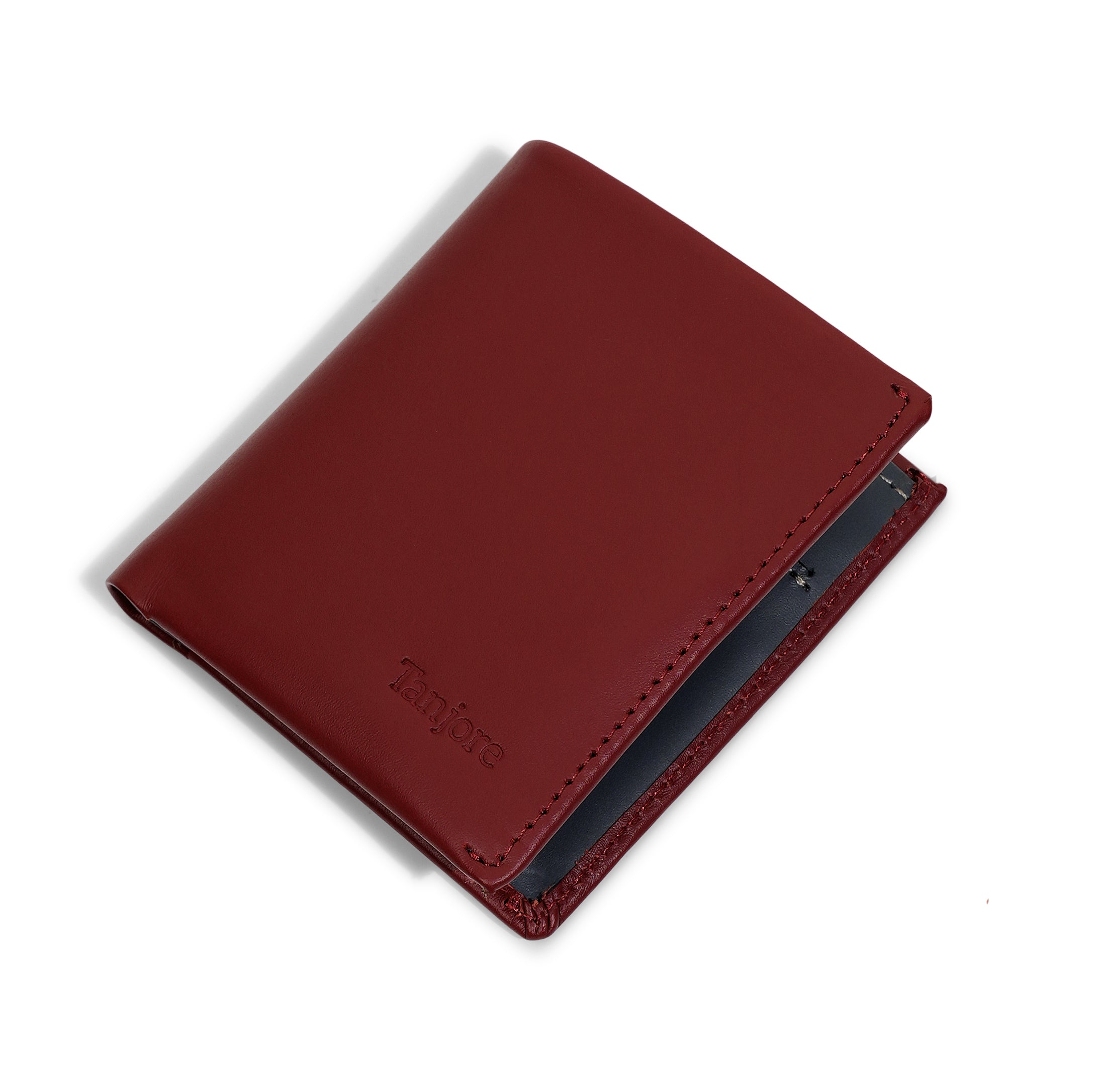 Angled perspective of the Reserve Sleeve in Plum. Shows the sleek vertical design and Full Grain Nappa Leather texture backed by a 3 year warranty.