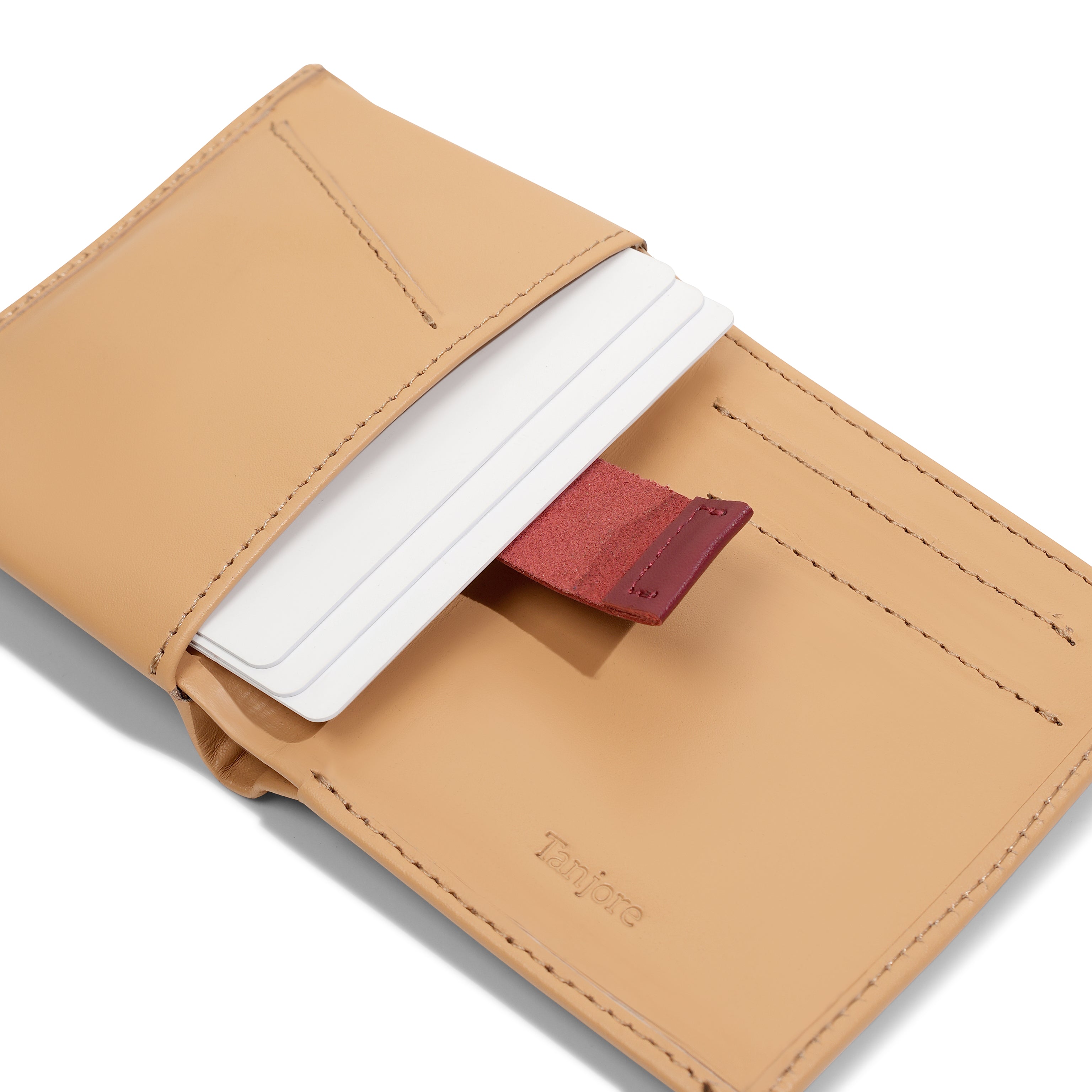 Close-up of the Pull Tab mechanism in the Tanjore Reserve Sleeve. Allows quick access to stored cards while maintaining a Slim Profile.