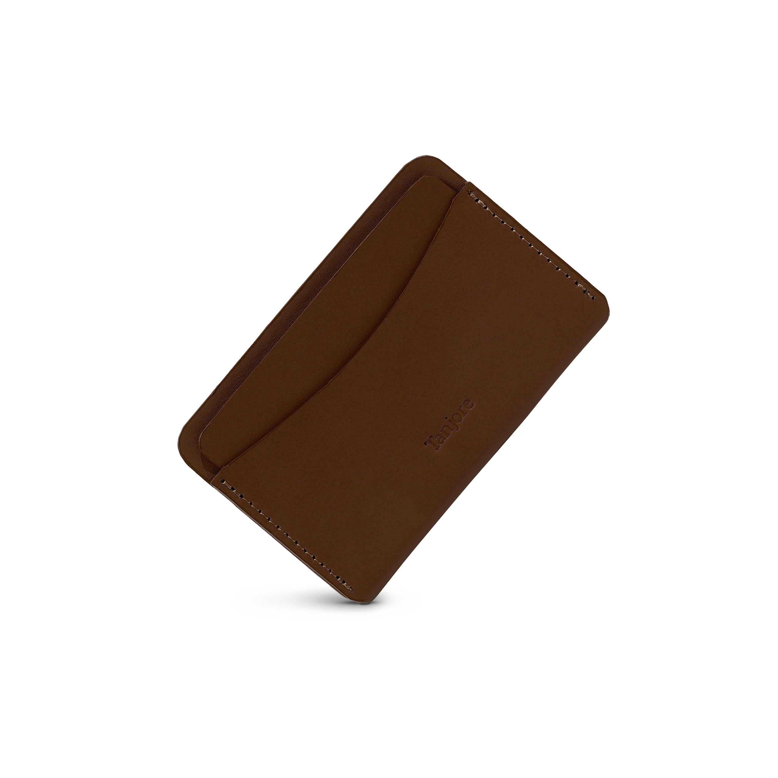 Angled shot of the ultra-slim Tanjore cardholder in Brown. The rich Full Grain Nappa Leather texture offers a luxury feel.