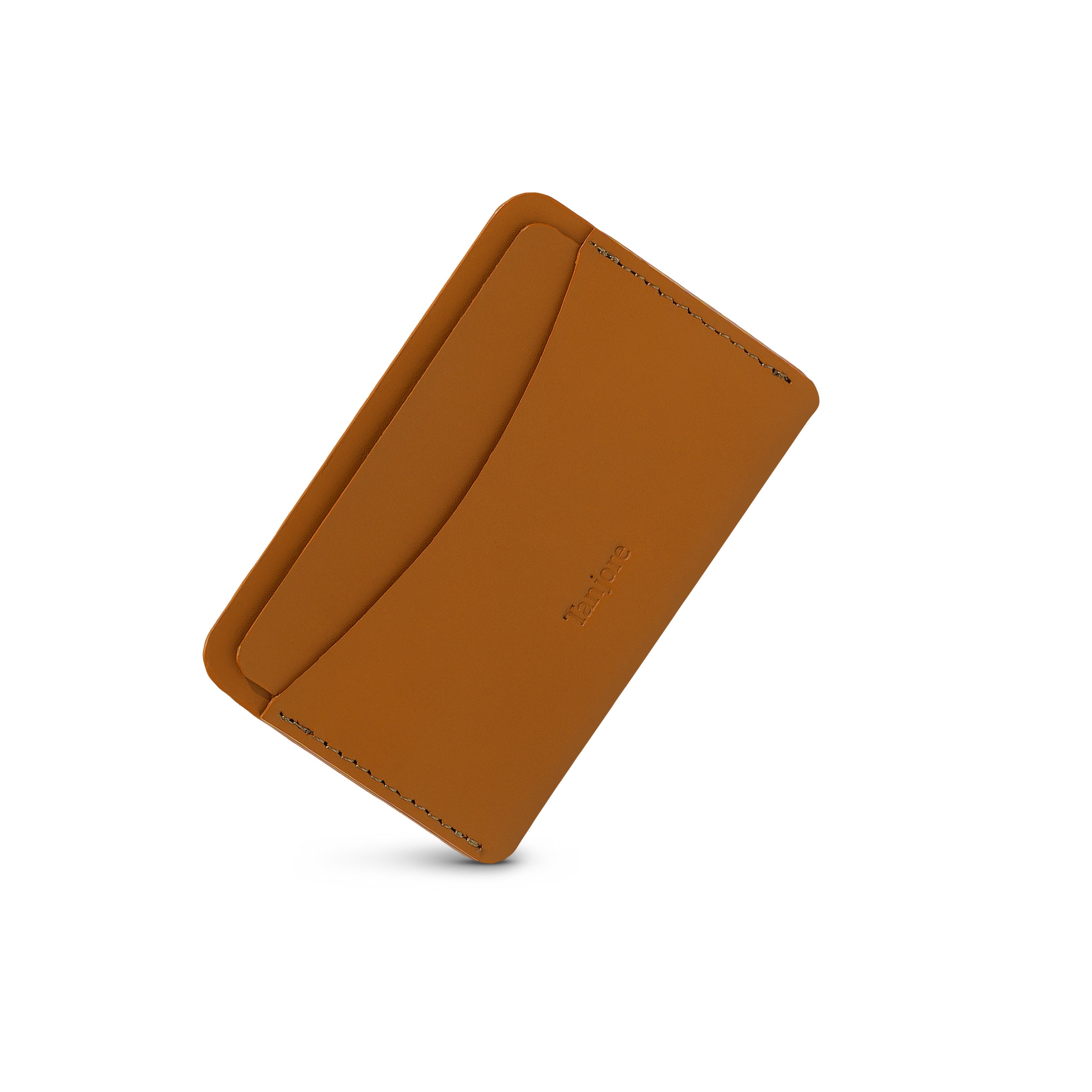 Angled shot of the ultra-slim Tanjore cardholder in Tan. The rich Full Grain Nappa Leather texture offers a luxury feel with a 3 year warranty.