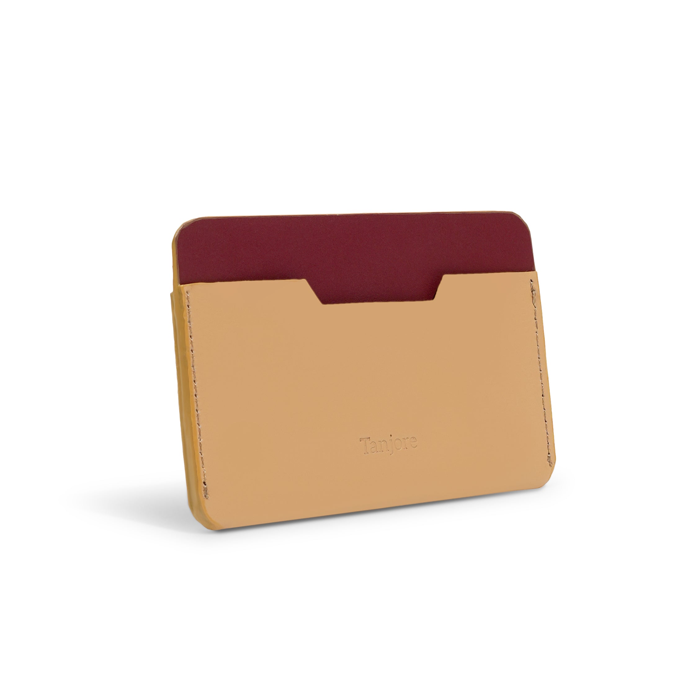 Rear view of the Tanjore card sleeve, highlighting the Clay leather front against the contrasting Plum backing. The smooth Full Grain Nappa Leather ensures longevity.