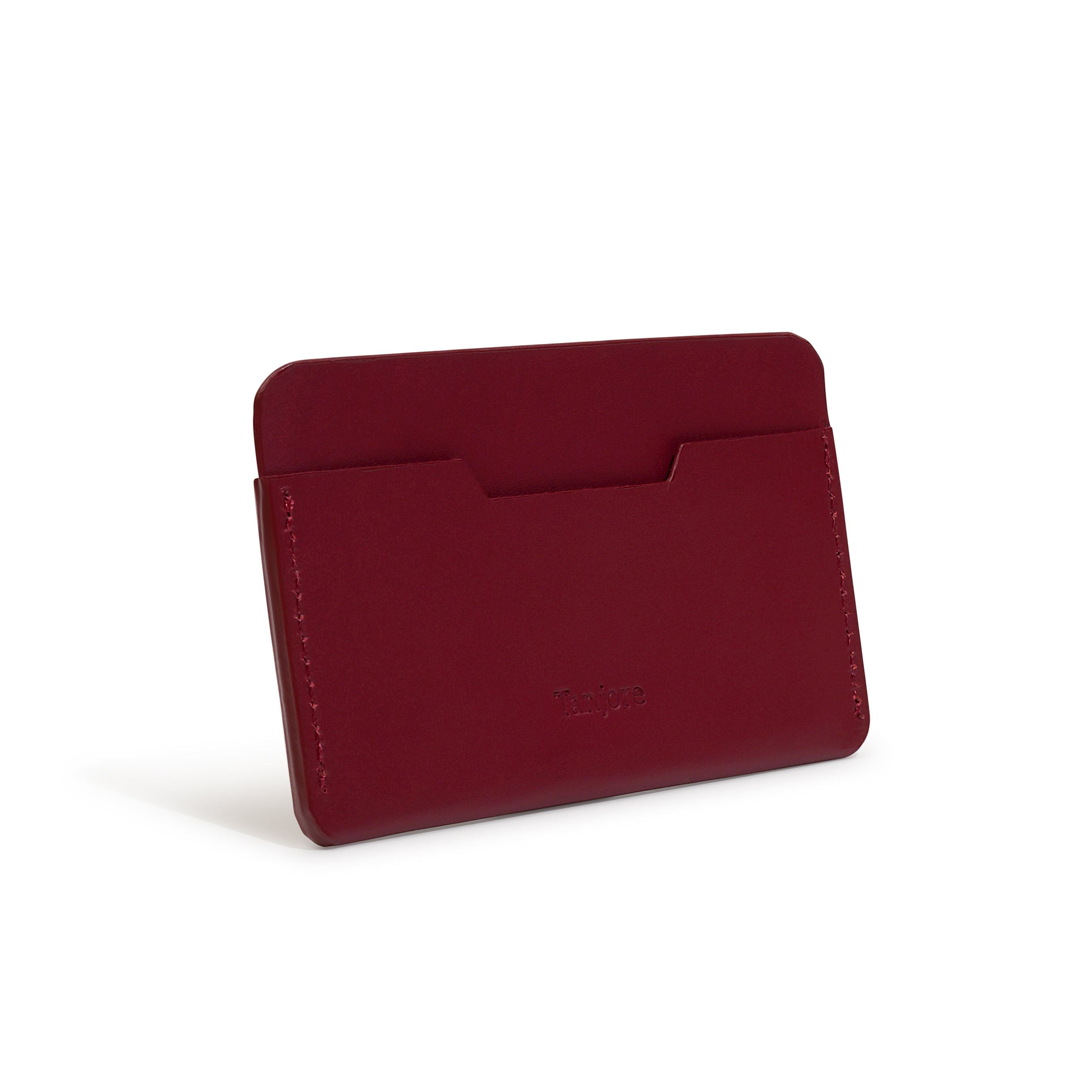 Rear view of the Plum leather card sleeve. The smooth Full Grain Nappa Leather construction offers a sophisticated look and durable finish.
