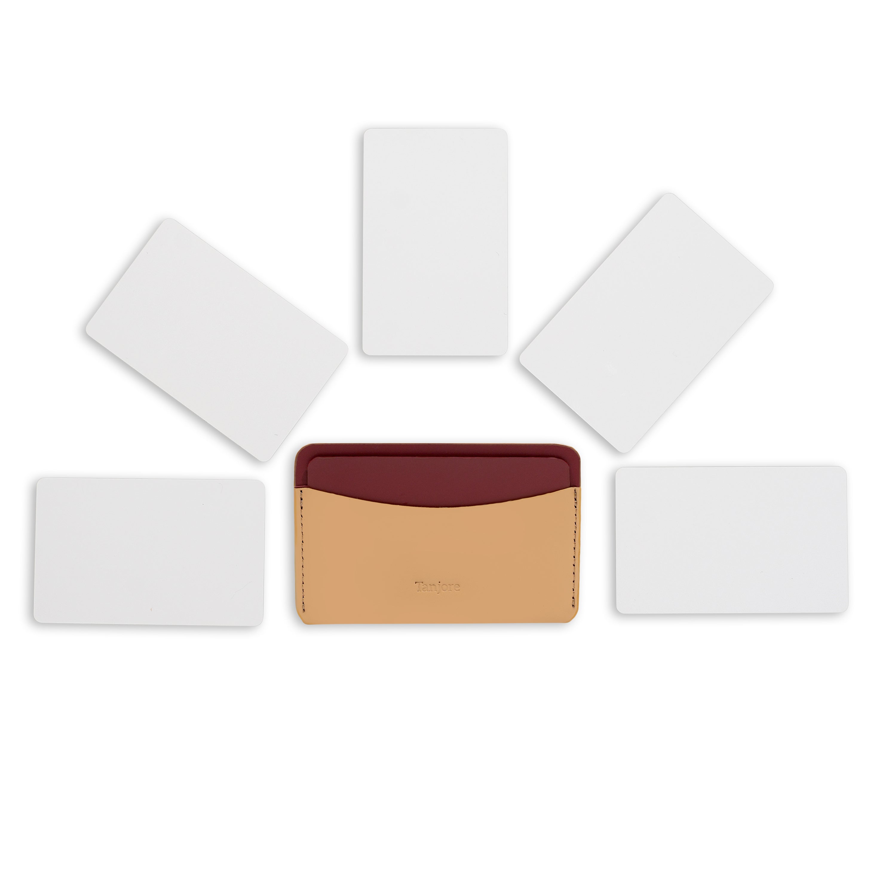 Overhead shot of the Clay and Plum Tanjore cardholder surrounded by five cards, illustrating its daily carry capacity. Made from high-quality Full Grain Nappa Leather.