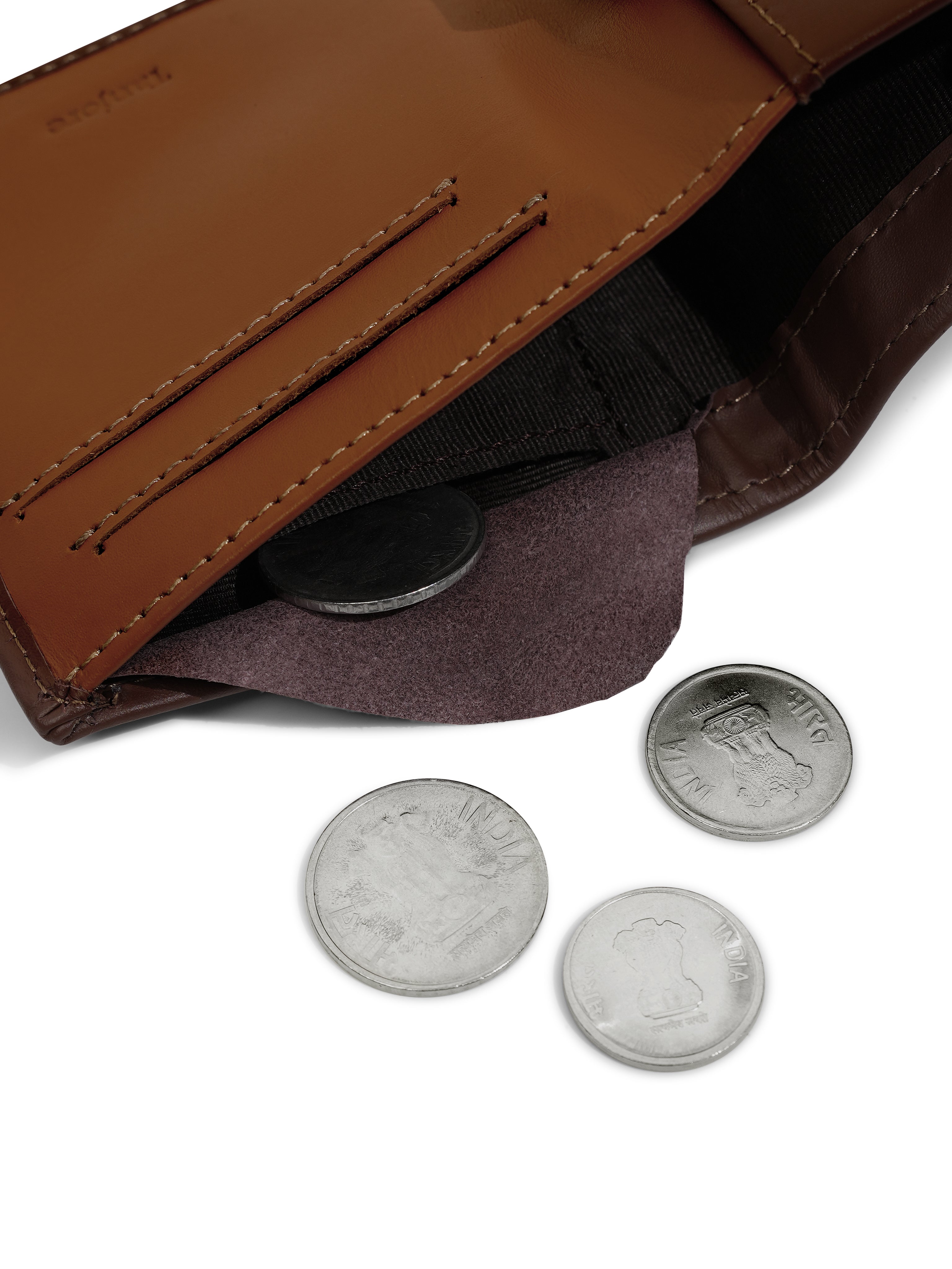 Close-up of the internal coin pocket in the Tanjore Reserve Sleeve in Brown. Functional Full Grain Nappa Leather design featuring RFID protection and a Slim Profile.