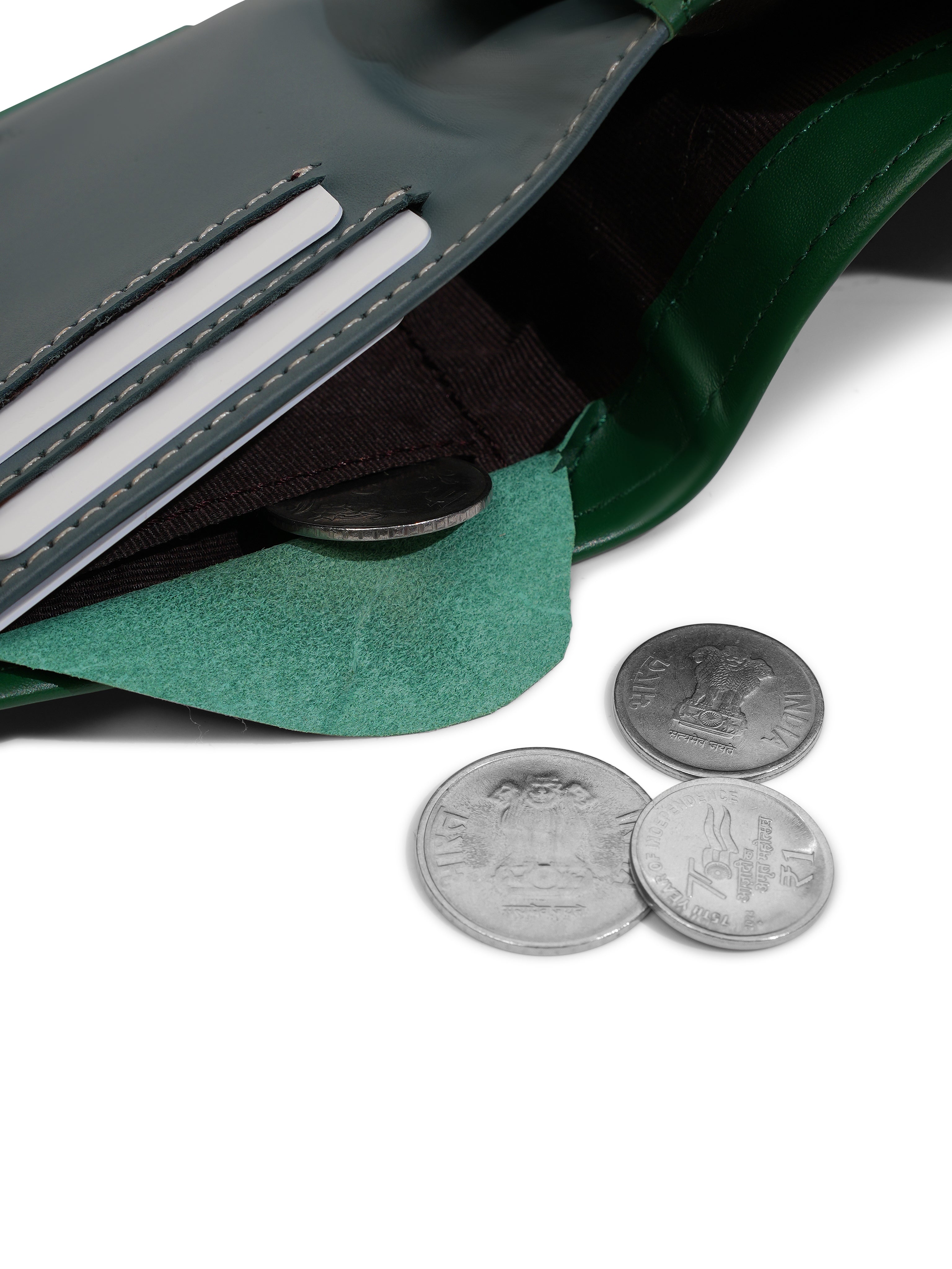 Close-up of the internal coin pocket in the Tanjore Reserve Sleeve in Green. Functional Full Grain Nappa Leather design featuring RFID protection and a Slim Profile.