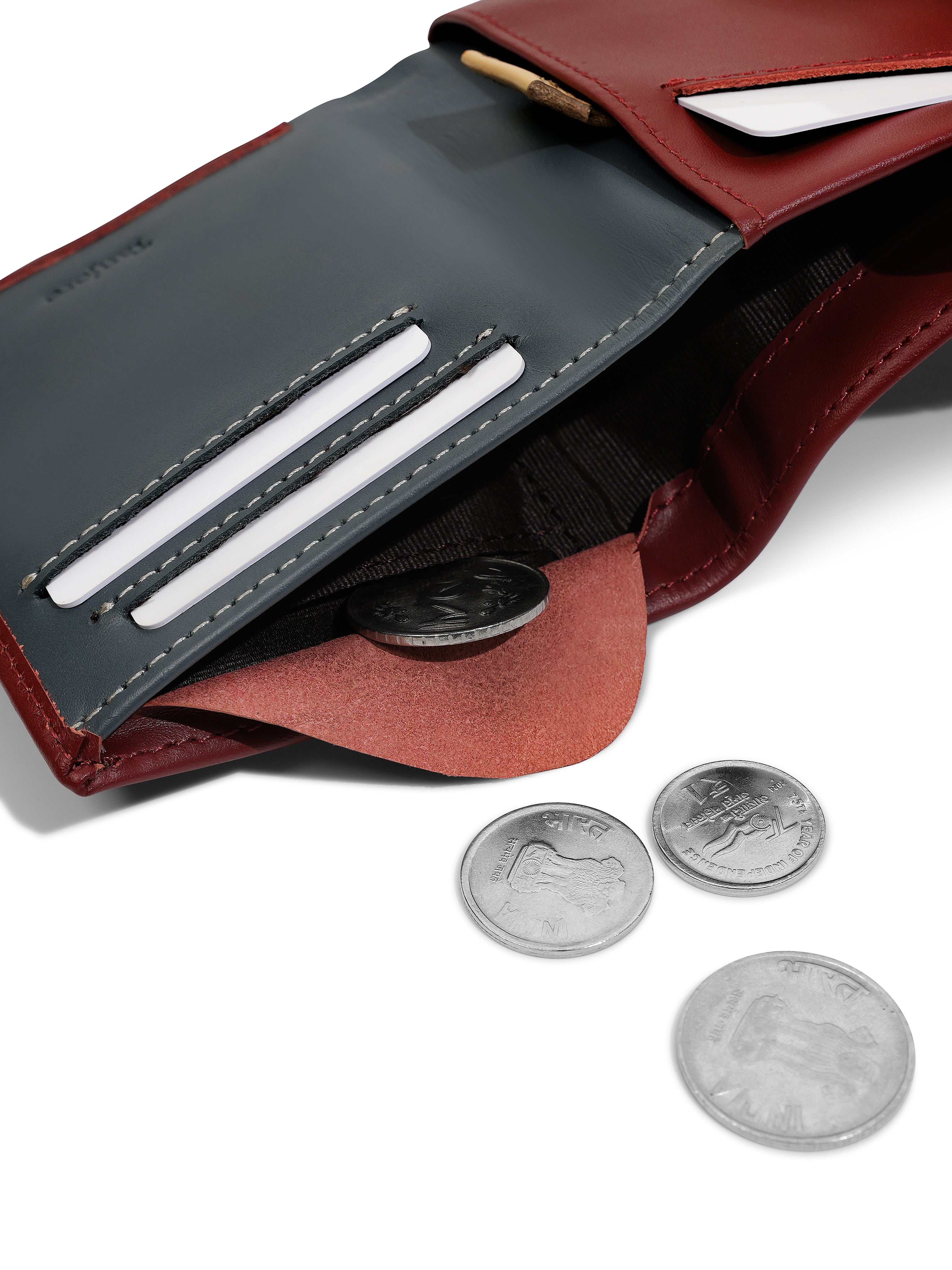 Close-up of the internal coin pocket in the Tanjore Reserve Sleeve in Plum. Functional Full Grain Nappa Leather design featuring RFID protection and a Slim Profile.