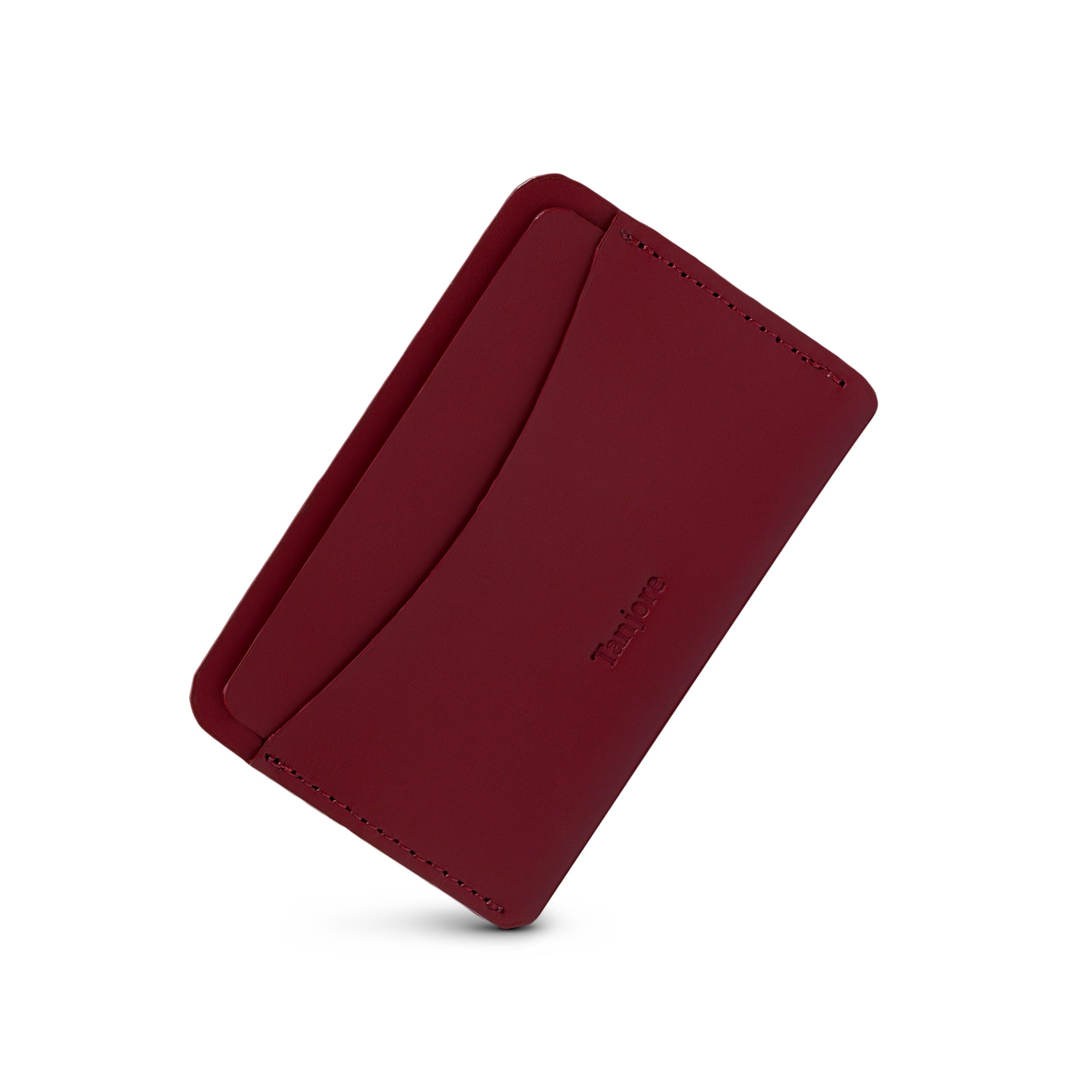 Angled shot of the ultra-slim Tanjore cardholder in Plum. The rich Full Grain Nappa Leather texture is highlighted, backed by a 3 year warranty.