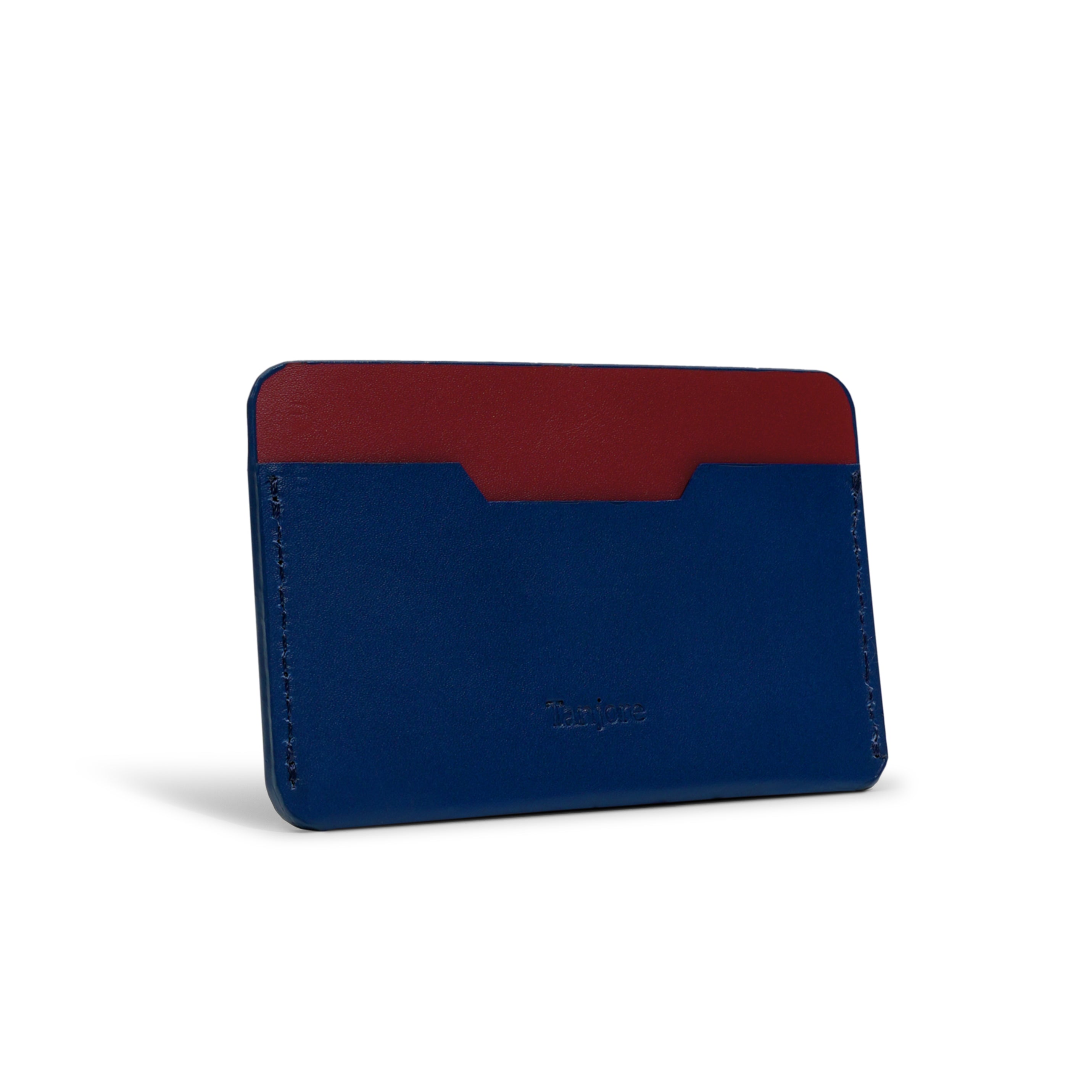 Rear view of the Tanjore card sleeve showing the deep Plum leather backing against the Navy Blue front. High-quality Full Grain Nappa Leather construction ensures longevity